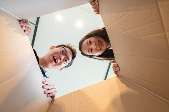 surprise gretting exited wife and husband unbox present gift together