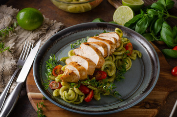 Homemade pesto pasta with grilled chicken