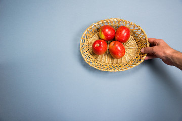 four apples in a basket