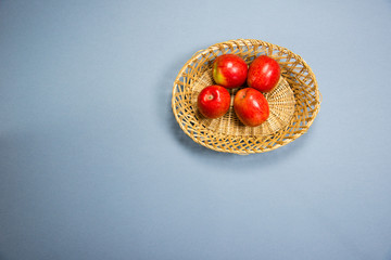 four apples in a basket