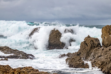 waves crashing on rocks
