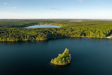 Aerial panoramic view; drone flying up and panning beautiful summer nature with lots of lakes surrounded by mixed forest of national Iremel reserve; natural picturesque landscape of Ural, Russia