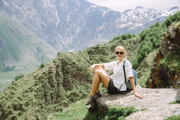Naklejka na ściany i meble Young woman tourist in the mountains of Georgia