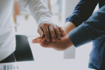 businessman joining united hand, business team touching hands together. unity teamwork partnership concept.