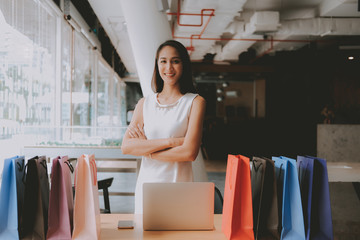 woman with shopping bags on table. consumerism lifestyle concept
