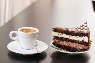 a cup of coffee and a piece of cake