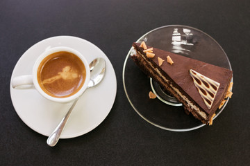 a cup of coffee and a piece of cake