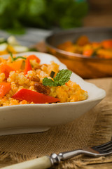 Millet with vegetables and raisins.