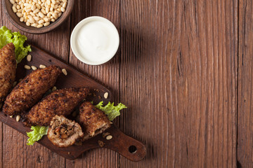 Traditional arabic kibbeh with lamb and pine nuts.