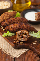Traditional arabic kibbeh with lamb and pine nuts.