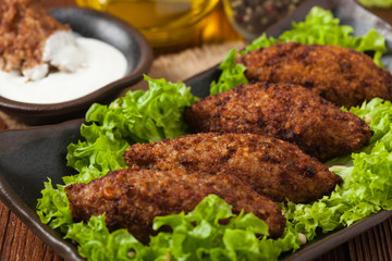 Traditional arabic kibbeh with lamb and pine nuts.