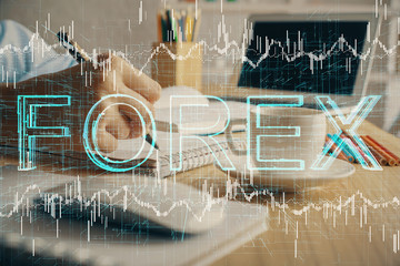 Financial chart drawn over hands taking notes background. Concept of research. Multi exposure