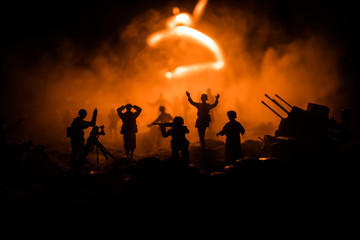 Fototapeta premium War Concept. Military silhouettes fighting scene on war fog sky background,