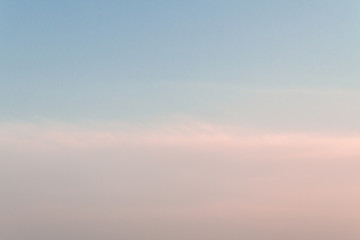 Beautiful sunset sky with feathery pink clouds in spring