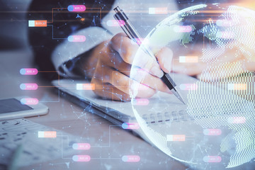 Multi exposure of hands making notes with world map hologram and data theme icons. Concept of global computer data.