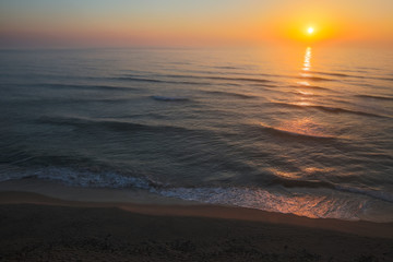 Fototapeta na wymiar Sun rising over the horizon