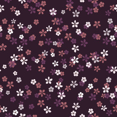 Fototapeta na wymiar Beautiful floral vector seamless pattern. Small white, pink and lilac flowers on purple background. Dark night meadow backdrop. Template for textile, carton, banner, ceramic tile, glass mosaic.