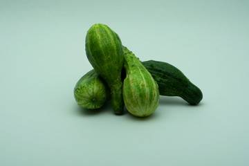Group deformed cucumbers on the white background.