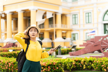 Woman traveler lost in the city used smart phone for searching location