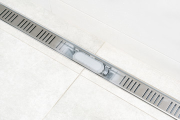 Linear shower drain system. With transparent grate to show internal siphon and all system. Shower...