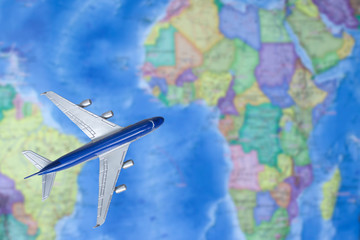 Fototapeta na wymiar Toy plane on the map. Air trip to Africa. travel by plane, booking tickets, flight by aircraft concept