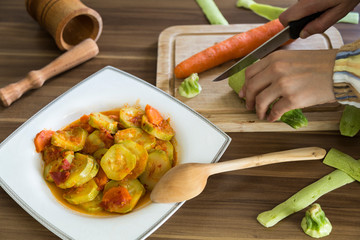 olive oil zucchini food in the white plate on the wooden table for restaurant or kitchen concept.
