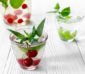 Fresh cool drink of ripe juicy cherry and gooseberry berries