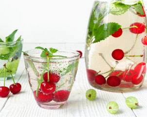 Fresh cool drink of ripe juicy cherry and gooseberry berries