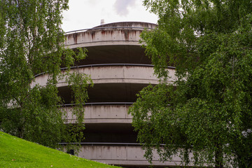 multi-storey car park with trees at the front