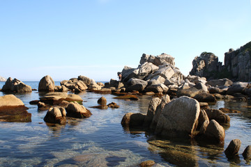 Beautiful landscape of a blue evening sea, horizon and rocks