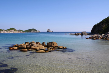 Beautiful landscape of a blue evening sea, horizon and rocks