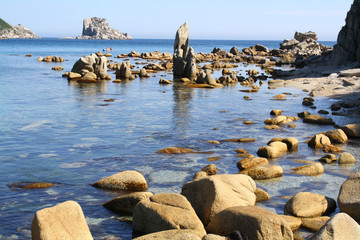 Beautiful landscape of a blue evening sea, horizon and rocks