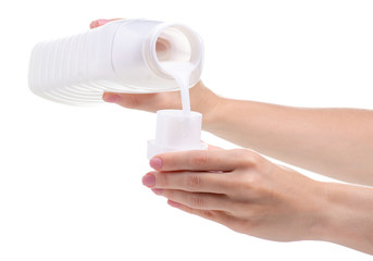 Softener conditioner in white plastic bottle in hand isolated on white background. Bottle with liquid laundry detergent, cleaning agent, bleach or fabric softener.
