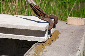 Installing concrete slabs at a construction site at home