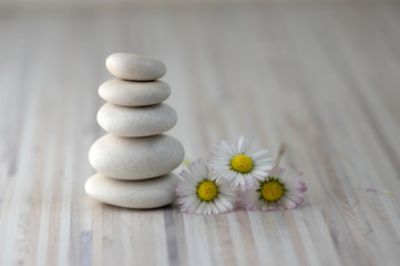 Naklejka na ściany i meble Harmony and balance, cairns, simple poise pebbles on wooden light white gray background, simplicity rock zen sculpture