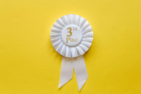 3rd Place White Ribbon Rosette On Yellow