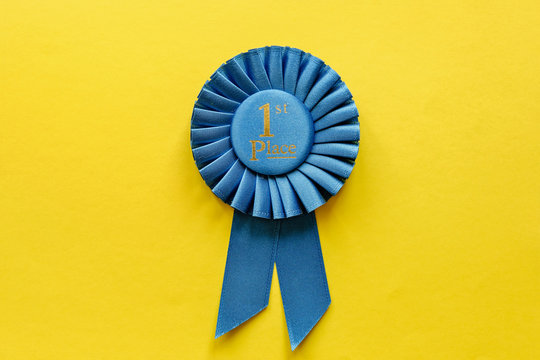 Blue ribbon rosette for the First Placed Winner