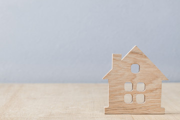 Obraz na płótnie Canvas little model toy symbol of house on wood background
