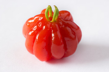 Pitanga fruit isolated on white. Brazilian cherry (Eugenia pitanga or Eugenia uniflora) is native...