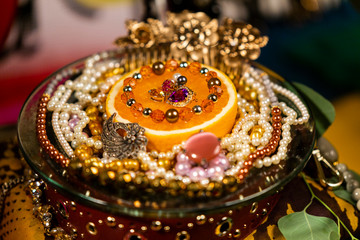 Orange Decorated With Jewellery and Natural Pearls