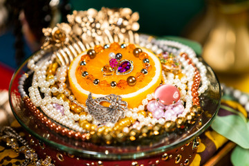 Orange Decorated With Jewellery and Natural Pearls