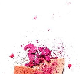 Crushed eyeshadow palette and powder close-up isolated on white background