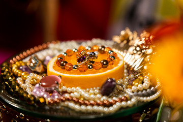 Orange Decorated With Jewellery and Natural Pearls