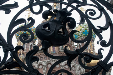 St Petersburg Russia, Church of the Savior on Spilled Blood viewed through wrought iron gate of...
