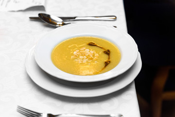 vegan gluten-free celery cream with almond flakes based on a dark miso paste