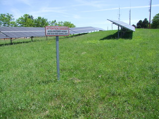 bench in park with blue sky and clouds