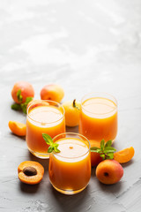 Fresh apricot juice on the marble table