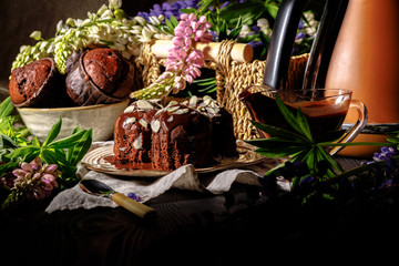 Chocolate muffins on the table, dark background