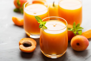 Fresh apricot juice on the marble table