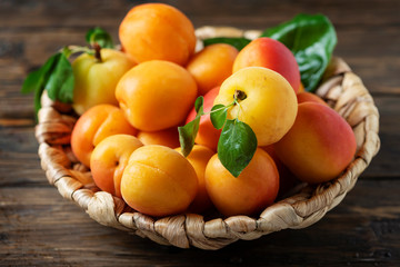 Naklejka na ściany i meble Sweet apricots on the wooden table